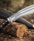 Iraqi Style Kukri Knife With An 8 Inch Blade, Hand Forged In Nepal, 5160 Carbon Steel, Full Tang Fixed Blade With Guard on wood