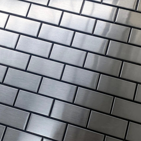 Close-up of Stainless Steel Peel And Stick Backsplash Tiles Set Of 10 Sheets with 3D Metal Subway Silver Brick Mosaic pattern for DIY use.