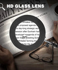 Ultimate Crafting Desk Magnifier Lamp With Light, 8x And 10x Dual Magnification Glass over newspaper text, focus on details.