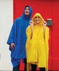 Adult Lightweight Hooded Packable Poncho With Side Snaps For All Weather Protection, Go To Rain Gear That Packs Into Its Own Pouch, Maximum Coverage When You Need It displayed on two people, one in yellow poncho and one in blue poncho against a colorful background with red door.