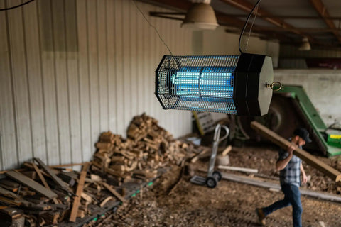No Nonsense Indoor Outdoor Bug Zapper For Homes And Yards Kills Flies And Mosquitoes With Dual Lure Tech 120W UV Light in a barn setting
