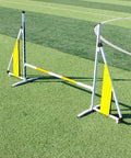 Adjustable Dog Agility Training Kit With Foldable Aluminum Obstacle Course set up on grass field, yellow panels visible