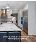 Kitchen lit by Zigbee A19 Daylight LED Light Bulbs, 8 Pack, 60W Equivalent, Hub Required, contemporary design with wood flooring.