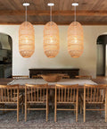 Dining room with three Boho Chic Natural Rattan Pendant Lights With Woven Shade, 1 Light Hanging Ceiling Lamp For Bar And Hallway