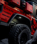 Cyclone V2 LED 5W Flood Beam Light With Clear Lens installed in off-road vehicle wheel well