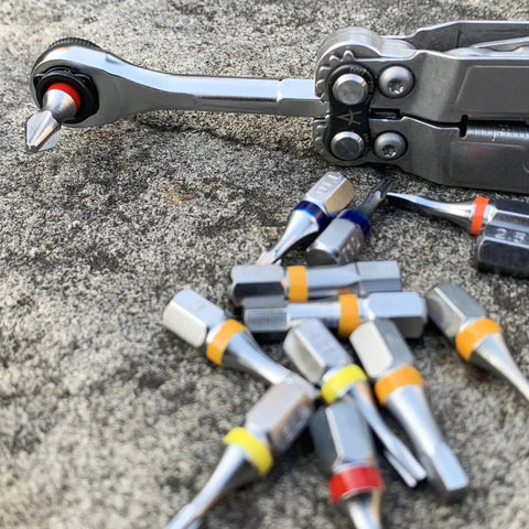 Go To One Quarter Inch Hex End EDC Ratchet Wrench For Multitools With Hex Bit Adapters Stainless Steel Build on stone surface