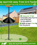 Squirrel Proof Baffle For Bird Feeder Pole Mount Outdoor Guard Stopper Black 16 Inch installed in a garden on a pole.