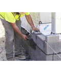 Worker using Philadelphia Style Brick Trowel With DuraSoft Handle For Brickwork Blockwork And Stonework, 11 X 5 And A Half Inch, Pro Grade Masonry Tool For Pros And DIYers, High Carbon Steel One Piece Forged, Clean Finish, Heavy Duty USA Made on masonry wall