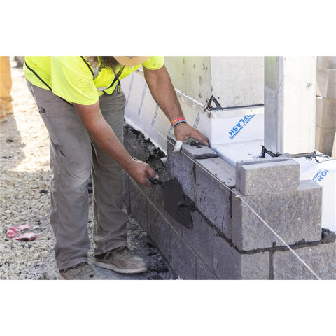 Worker using Philadelphia Style Brick Trowel With DuraSoft Handle For Brickwork Blockwork And Stonework, 11 X 5 And A Half Inch, Pro Grade Masonry Tool For Pros And DIYers, High Carbon Steel One Piece Forged, Clean Finish, Heavy Duty USA Made on masonry wall