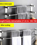 Freely Retractable Stainless Steel 304 Towel Rack Two Layer 20 To 30 Inch demonstrating length extension on wall.