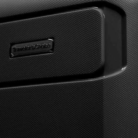 Traveler's Choice hardside luggage close-up of black textured shell with logo plate