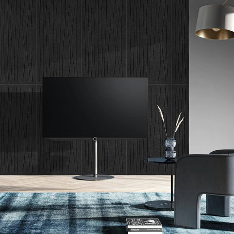6 Pack Acoustic Wall Panels 47.2 By 23.6 Inches Black Sound Proof Panels on textured wall behind TV in modern decor.