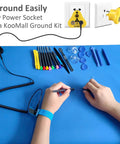 Front view: blue ESD rubber work mat with anti-static wrist strap, grounding kit and assorted repair tools