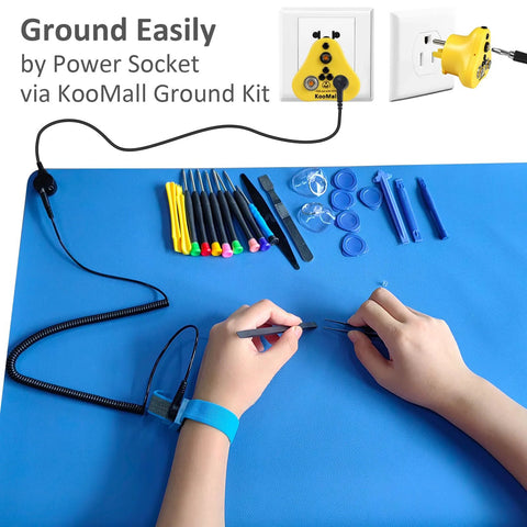 Front view: blue ESD rubber work mat with anti-static wrist strap, grounding kit and assorted repair tools