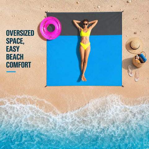Woman relaxing on sandproof waterproof beach blanket, extra large 79x55 inch outdoor mat for 1-4 adults, with beach gear