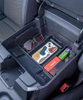 Full Center Console Organizer With Wireless Charging For 2022 2023 2024 2025 2026 Chevy Silverado And GMC Sierra 1500 2500HD 3500HD Crew Cab Fits Bucket Seats Only Keeps Phones Cables And Gear Neat Within Reach showing organized storage of phone and accessories