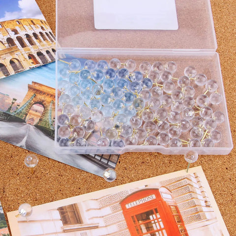 Heavy Duty Gold Push Pins With Crisp Clear Round Heads Top Shelf Office Gear For Maps Bulletin Boards And Cork Walls 100 Count in a clear storage box.
