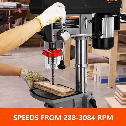 Heavy Duty 15 Inch Floor Drill Press With Rock Solid 7.5 Amp Pure Copper Motor And Slick Variable Speed Up To 3084 RPM in use, drilling wood.