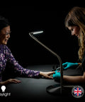 Woman using Slimline LED Table Lamp With 80 CRI Eye Care, 4 Dope Brightness Levels for detailed task lighting on desk