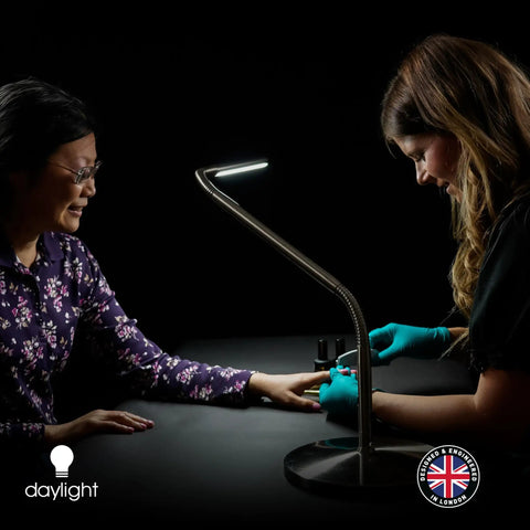 Woman using Slimline LED Table Lamp With 80 CRI Eye Care, 4 Dope Brightness Levels for detailed task lighting on desk