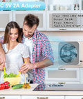 Couple cooking with 10 Inch Box Fan With 3 Speeds And 8 Hour Timer Quiet Square Window Fan in kitchen, wall mounted.