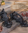 Solid Cast Iron Gate Handles Set 2 Pack Heavy Duty 8.7 Inch Long Barn Door Pulls shown with rustic decor background