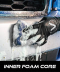Mesh Bug Scrub Sponge For Cars 4x6 Inch, Tar And Bug Remover, in use on vehicle bumper, showing inner foam core, safe on paint.