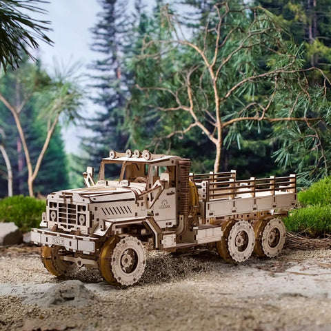 Cargo Truck 3D Puzzle Kit For Adults With Spring Powered Mechanics, Realistic Wooden Model Truck Build Featuring Three Axles And Differentials, Brain Teaser Hobby Set For Makers And Auto Enthusiasts, side view on forest path