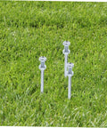 Durable Lawn Aerator Spike Shoes With Metal Pegs For Deep Soil Aeration showcased with metal spikes on grass