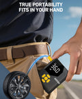 L7 Mini Tire Inflator Portable Air Compressor with LED Light in hand, showing size and portability for easy carrying