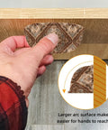 Close-up of a hand pulling a drawer with a Vintage Shell Shaped Drawer Pull 3.4 Inch with rustic ethnic pattern on wooden surface.
