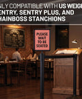 Sign Holder With Plexiglass Covers For Stanchions Compatible With Chain Boss And Sentry Posts in restaurant setting