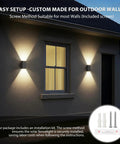 Hella Bright Solar Wall Light Outdoor Featuring Slick Up And Down Lighting installed on an outdoor wall with included screws.