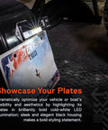 Beefed Up Black LED License Plate Light illuminating a Texas truck plate on a vehicle, showcasing visibility with bold white LED light.
