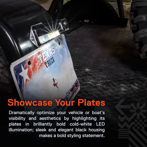Beefed Up Black LED License Plate Light illuminating a Texas truck plate on a vehicle, showcasing visibility with bold white LED light.