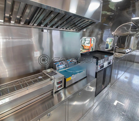 Fully Equipped Compact Concession Food Trailer Mobile Kitchen For Street Vending interior with stainless steel workspace and appliances.