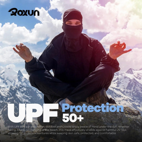 Person wearing All Season Ski Mask Balaclava With Windproof Warmth And Cooling Breathable UV Protection for outdoor adventures in mountains.