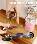 Hands using Stainless Steel Magnetic Measuring Spoons Set Eight Piece Dual Sided And Stackable Teaspoon And Tablespoon Measures With Leveler.