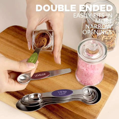 Hands using Stainless Steel Magnetic Measuring Spoons Set Eight Piece Dual Sided And Stackable Teaspoon And Tablespoon Measures With Leveler.