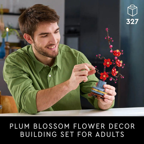 Botanicals Plum Blossom Building Set For Adults Diy Flower Craft Kit For Dining Table Centerpiece And Living Room Decor Grown Folks Friendly 18 Plus Relaxing Creative Experience Gift For Birthdays 10369, man assembling 327-piece plum blossom display