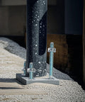 Quarter Inch By Four Inch Heavy Duty Zinc Wedge Anchors For Concrete And Masonry securing a pole to concrete surface
