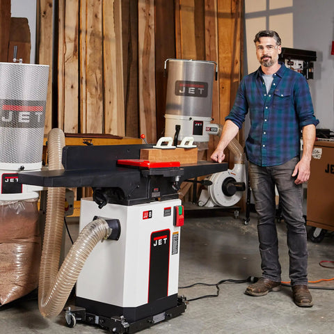 Badass Eight Inch Jointer Featuring Helical Cutterhead And Two Horsepower Motor in a workshop, showing smooth cuts and powerful performance.
