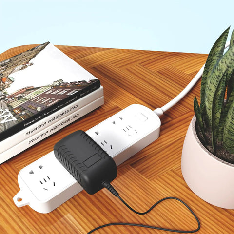 Heavy Duty Six Volt AC Adapter And Power Supply Charger For Cordless Grinders And Impact Drivers featuring sleek design plugged into power strip.
