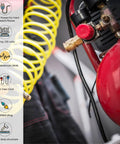 Air compressor with red tank beside yellow coiled hose, showcasing features of 100 Ft Outdoor Extension Cord 14/3 SJTW Black Contractor Grade