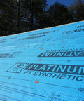 Professional Grade Synthetic Roofing Underlayment Roll, 20 Mil Polyolefin Core laid out on a roof with textured surface.
