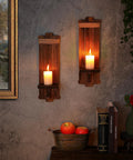 Handmade Paulownia Wood Candle Sconces Set Of Two Vintage Rustic Farmhouse Wall Decor with lit candles and decor accents.