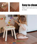 Child painting on wall with Clear Chair Mat For Hard Floors 30x48 Inch, Transparent Office Floor Protector under table.