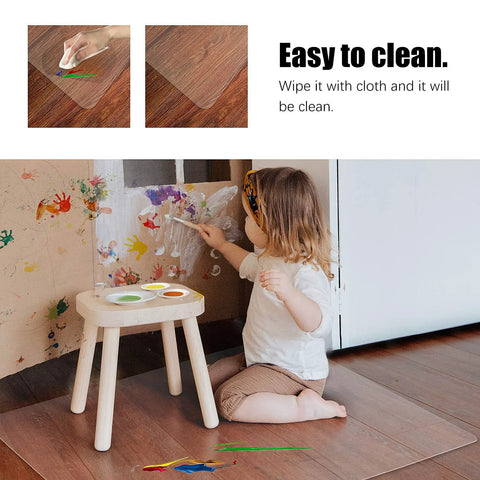 Child painting on wall with Clear Chair Mat For Hard Floors 30x48 Inch, Transparent Office Floor Protector under table.