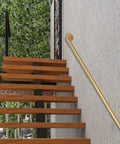 Industrial Pipe Stair Handrail Kit Golden Wall Mounted Railing System, 6m long, gold finish, on wooden stairs with greenery.