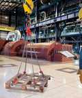 Front view of a 4-leg 5/16 in x 5 ft chain sling with red hooks lifting a wooden pallet in an industrial plant